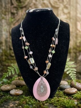 Handmade pink pendant with broken shells